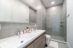 Dual vanity master bathroom with luxurious walk-in shower.